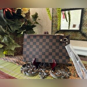 Fashion Checkered Brown Clutch / wristlet - NWOT - made of quality material .